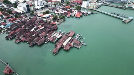 tilt houses sea port location aerial view at penang island, jetty in george town