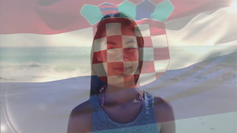 At beach, woman with Croatian flag animation overlay on her face