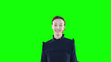 caucasian woman raising hands on green background