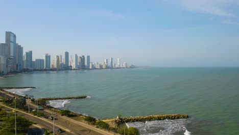 modern cartagena skyline, low birds eye aerial view with cars driving on highway