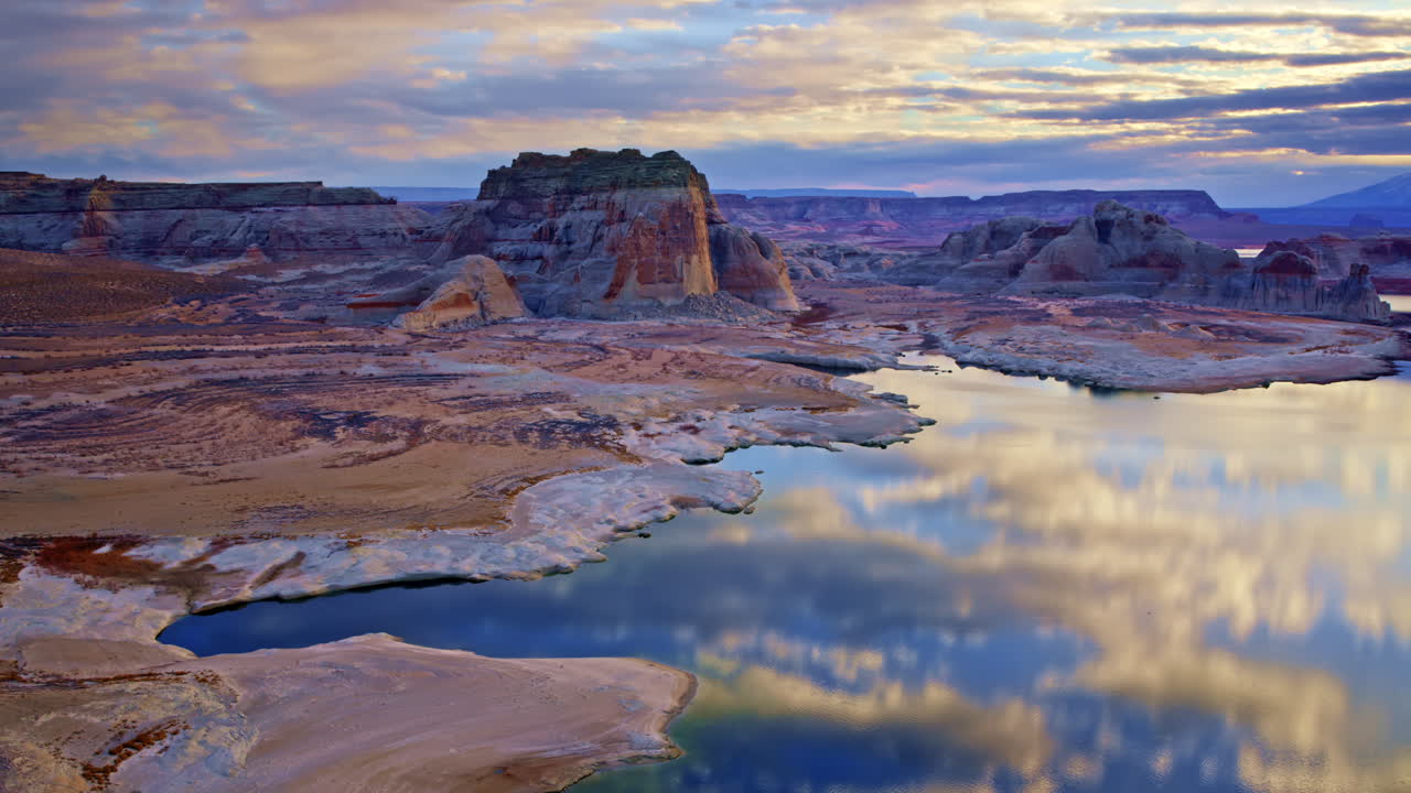 The drone advances toward impressive rock structures near Lake Powell in Page, Arizona.