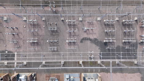 aerial ascent over electric substation with electrical infrastructure