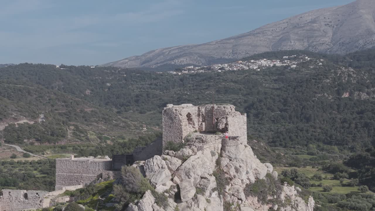 Bird's eye view of Kritinia Castle captured by professional drone equipment. This ancient Knights of Rhodes fortress offers stunning panoramic views of the coastline. 3x Telephoto lens D-Log M