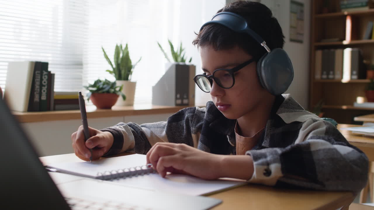 Focused Student Taking Notes