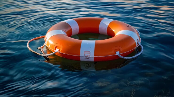 A life preserver floating in the water on a sunny day