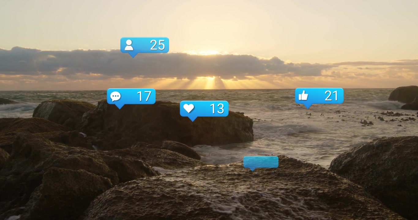 Sunrise revealing rocky seashore, notification bubbles hovering and counting up to show engagement
