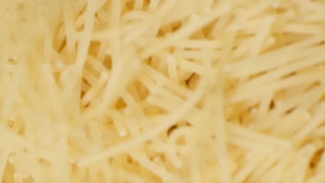 Close up of Raw Italian Pasta Cooking Pasta Close up of Raw Italian Pasta Cooking Pasta