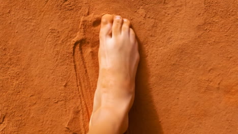 barefoot on sandy ground