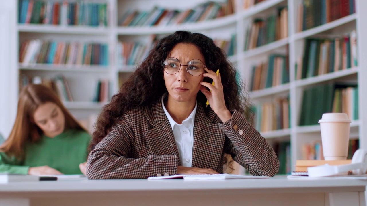 Focused Woman Studying in a Library