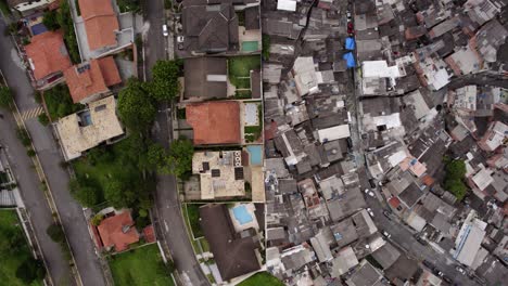 aerial view of class distinction in brazil, a wall separating the rich from the poor in sao paulo