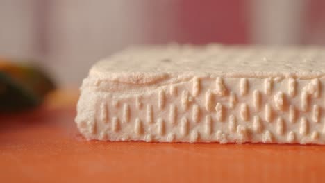block of tofu on a cutting board