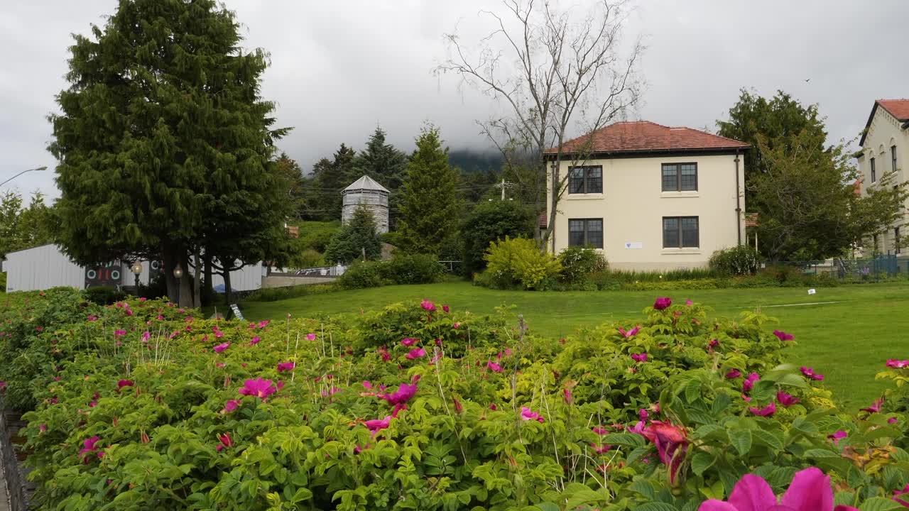 Russian Blockhouse on Kaagwaantaan Street and Sitka Kwaan Naa Kahidi Community House, on the left side. Sitka, Alaska.