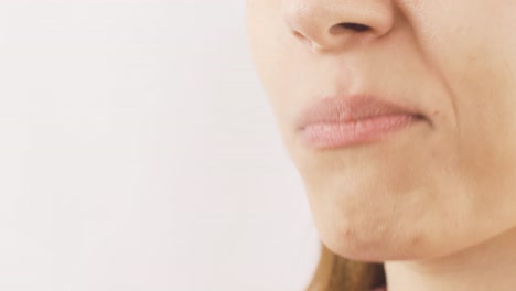 close-up of woman eating dragee. eating chocolate.