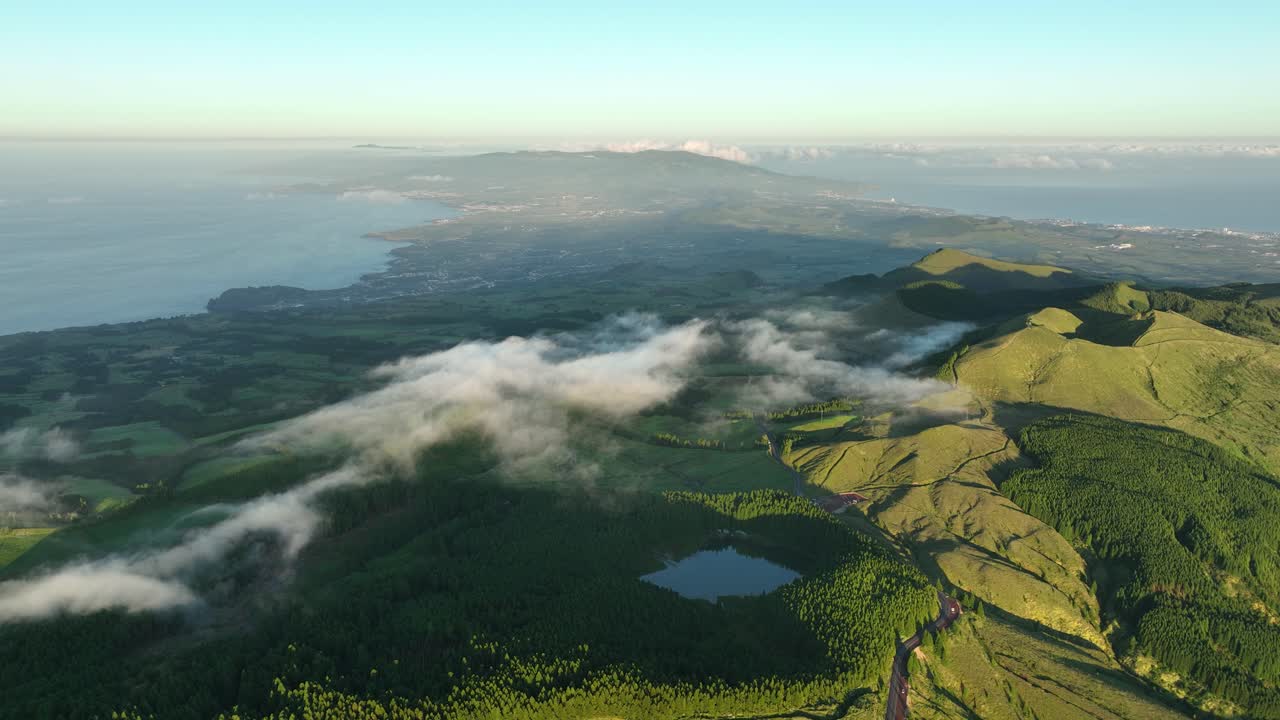 Low clouds float over verdure volcanic landscape of S&atilde;o Miguel, Azores