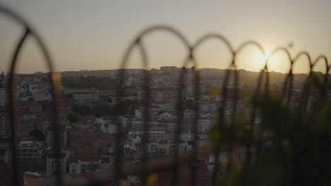 sunset city view from lisbon rooftop