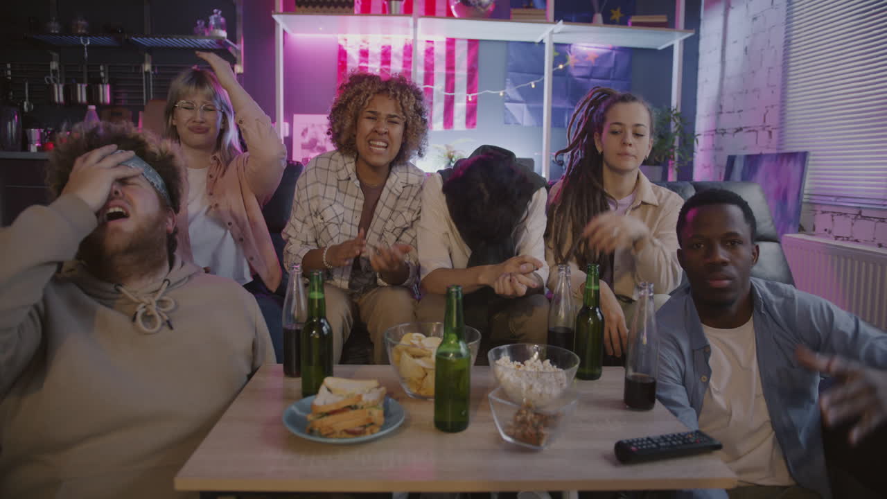 Friends watching a game/event at home