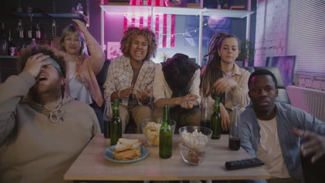 friends watching a game/event at home