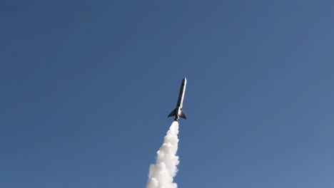 rocket launch into blue sky