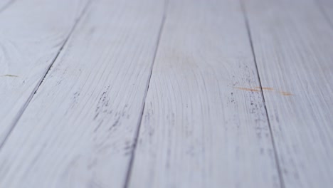 person hand cleaning table with cloth