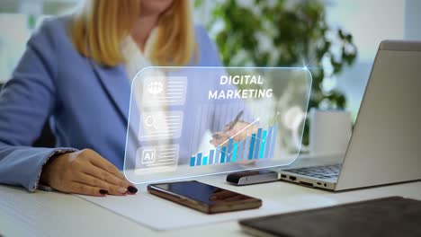 blonde business woman working with holographic projection screen laptop in modern office analysing the digital marketing trend for new efficient strategy