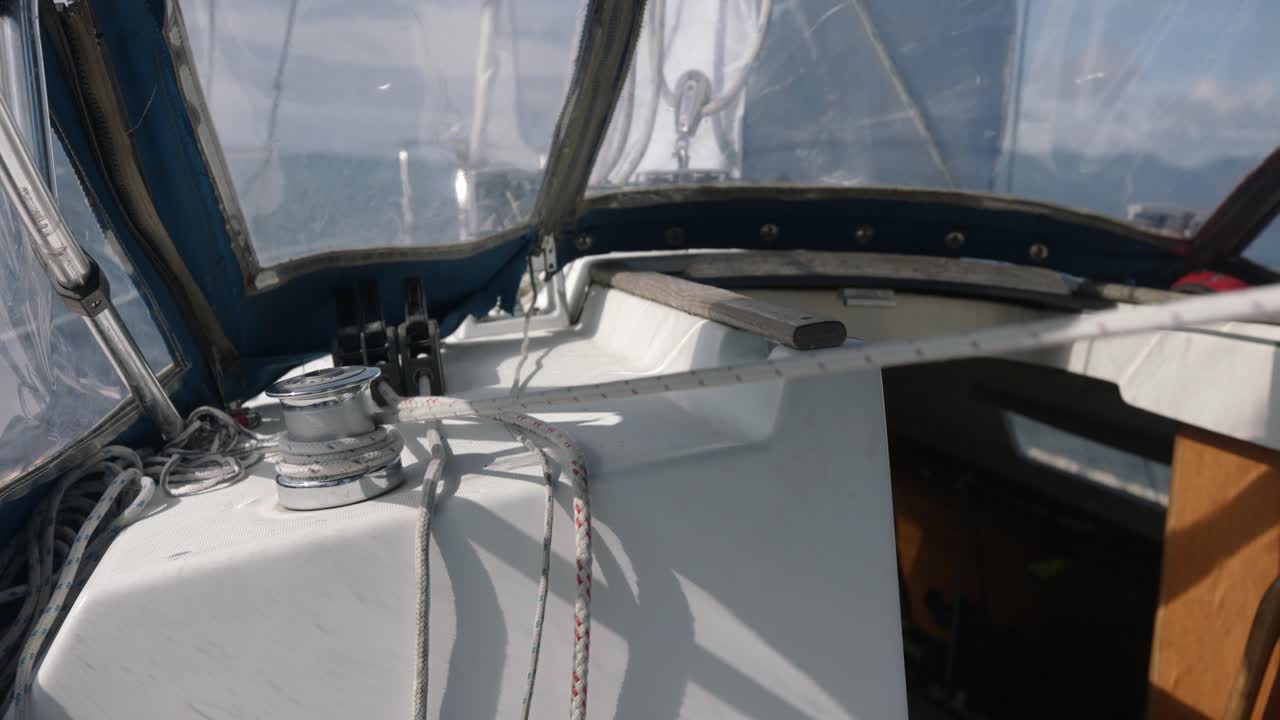 Ungloved Hands Of A Man Manually Pulling Rope On Winch