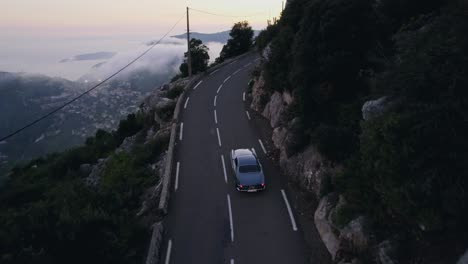 old vintage car driving in the french mountains outside monaco