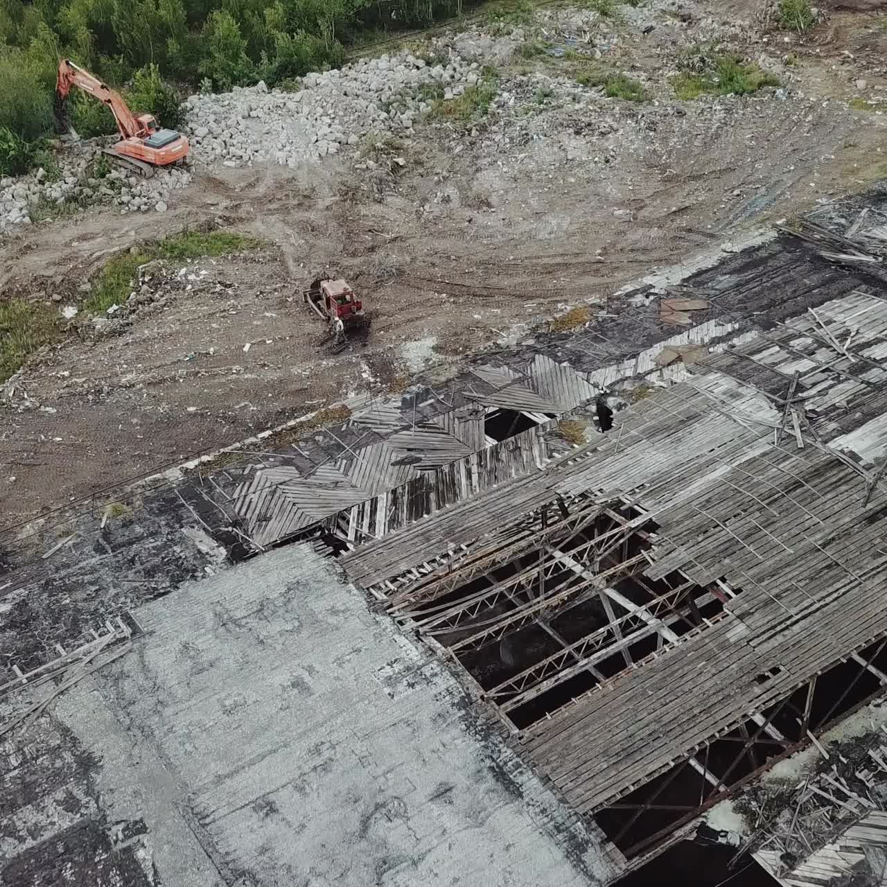 Flying over abandoned industrial factory buildings in very dilapidated condition. Old building for demolition.