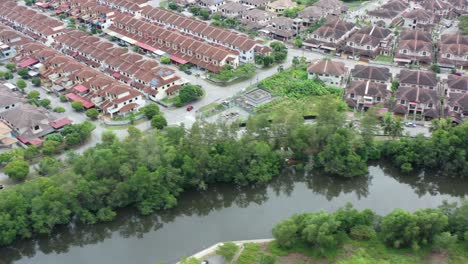 aerial drone flying around venice of perak, manjung, malaysia, capturing wide array of residential houses built upon salt water swampy area