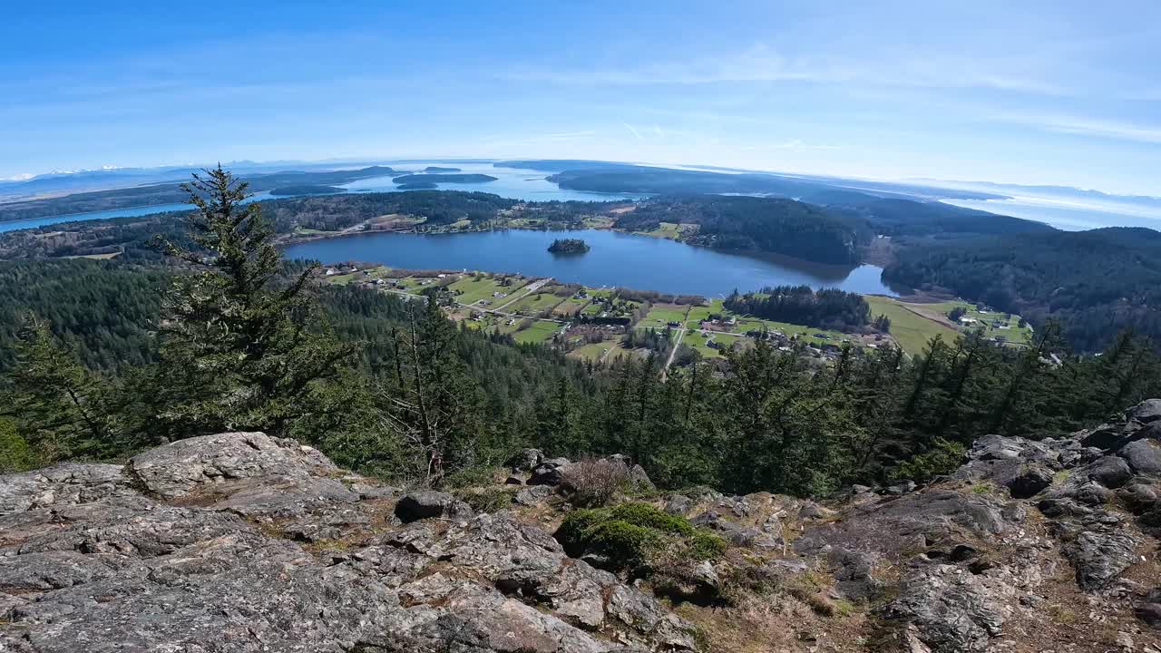Tilting shot from the summit of Mount Erie revealing Lake Campbell in Washington