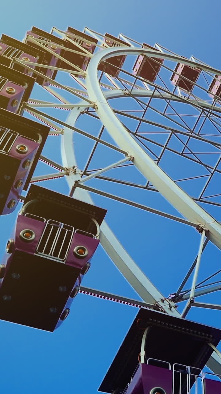 Ferris Wheel at amusement park. Big wheel Vertical video