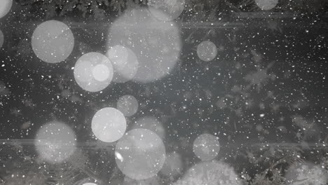 animation of snow falling over light spots on black background