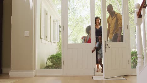 Two-generation-family-entering-their-house