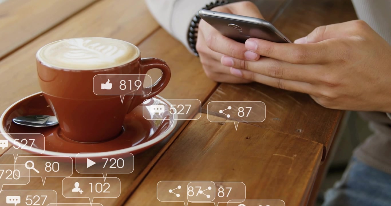 Person Using Smartphone with Social Media Notifications and Coffee