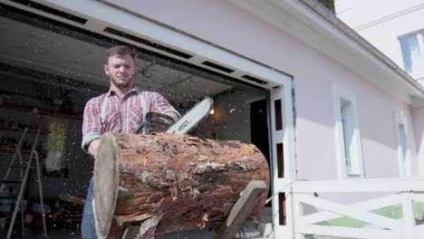 Man using chainsaw to cut a log outside