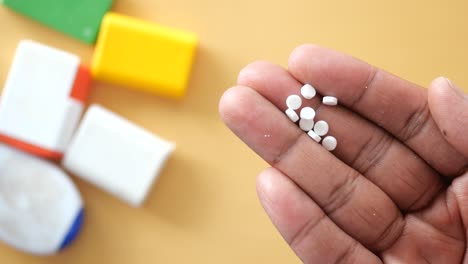 a hand holding sugar tablets