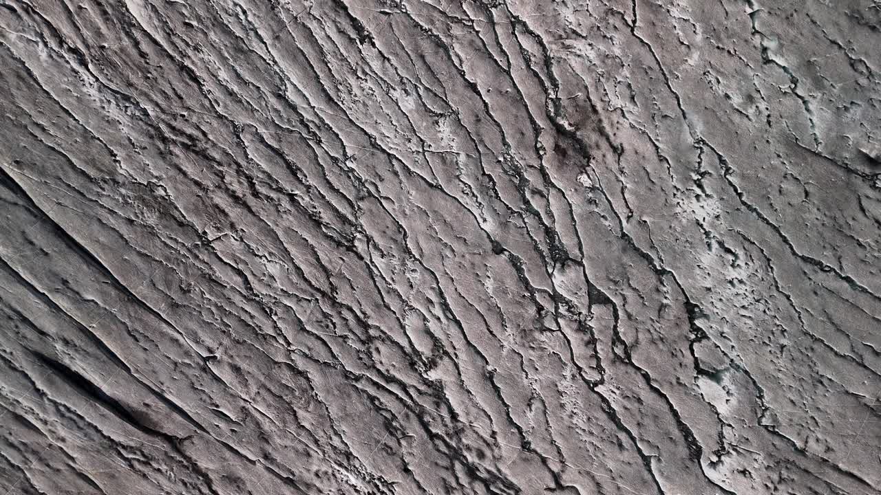 Top shot of the surface of the Rhone glacier, one of the most famous in the Swiss Alps. Rhone glacier near Furka Pass at the border of Uri and Valais.