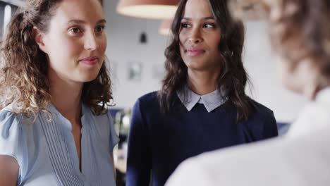 Diverse-female-colleagues-in-discussion-in-casual-office-meeting,-slow-motion