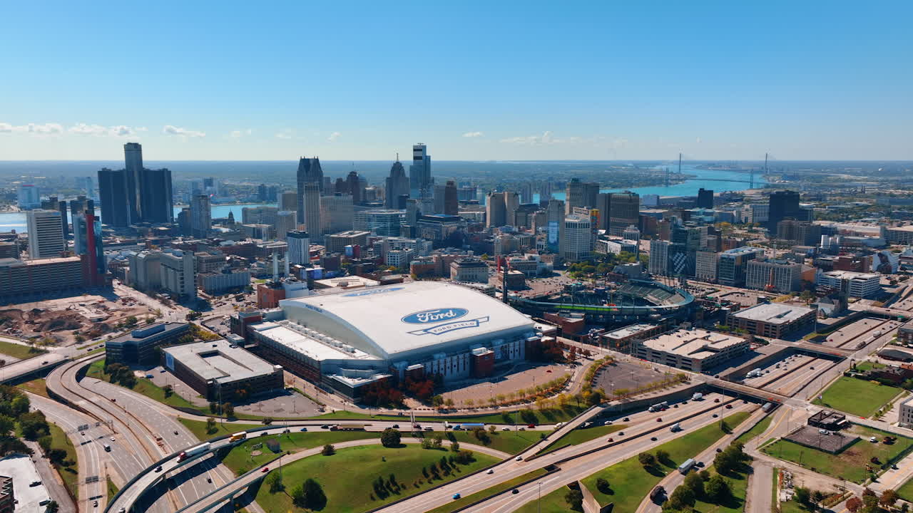 Detroit, USA, 28 July 2025: Many cars riding by the roads around Detroit midtown, Michigan, USA. Vast scenery of the city on sunny day from drone