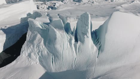 drone over sea and ice of ilulissat icefjord