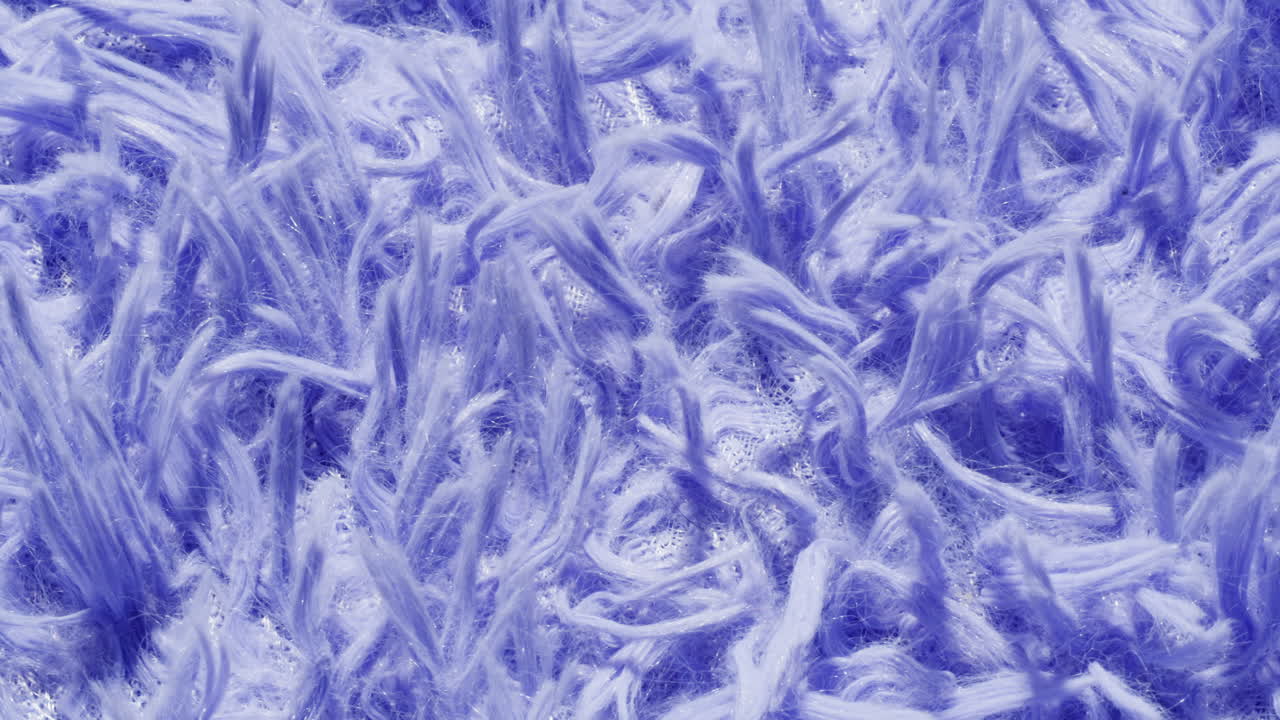 Close-up of a textured purple fluffy fabric