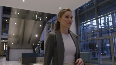 Businesswoman-walking-in-the-lobby-at-office-4k