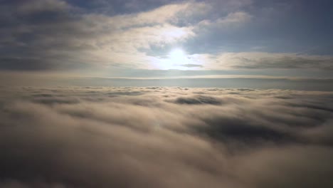 beautiful calming aerial view over the clouds from airplane