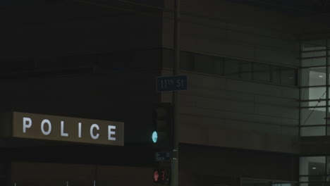 Police-station-and-cars-in-city-at-night