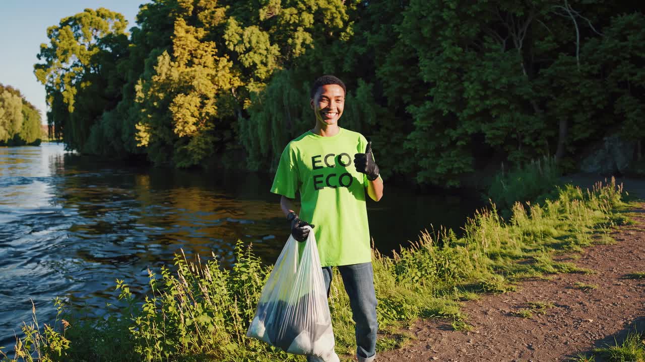 Smiling Volunteer Cleaning Up Riverbank