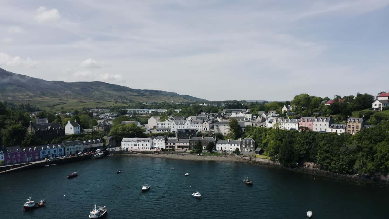 Aerial view pulling away from Scotland's shoreline in the Isle of Skye
