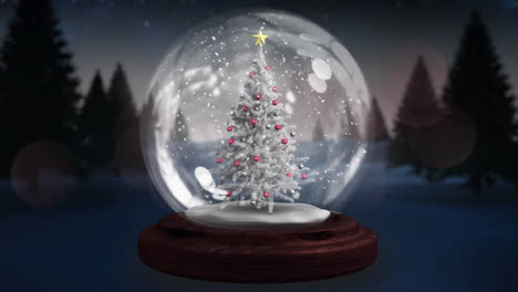 dos estrellas fugaz girando alrededor del árbol de navidad en un globo de nieve en el paisaje de invierno