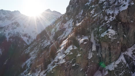 Aerial-of-rocky-mountain-side-in-winter