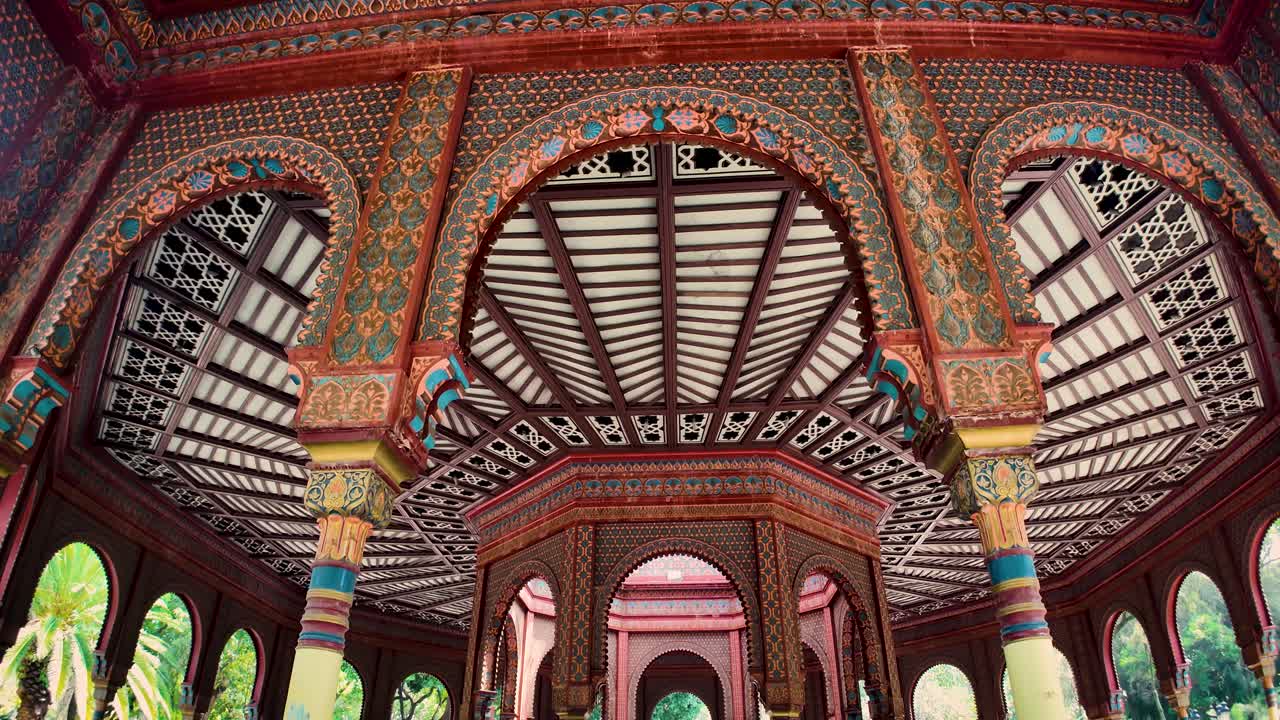 Descending contemplative shot of light entering the inner chamber through the central dome of the Moorish Kiosk in the popular Santa María la Ribera neighborhood in Mexico City