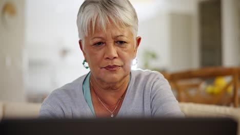 Senior-woman,-house-and-laptop-with-focus