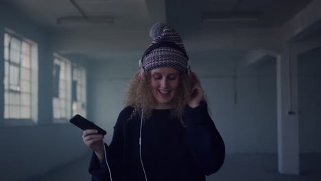 fashionable young woman in an abandoned warehouse